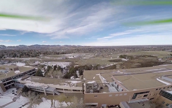 aerial view of buildings in an urban, dry setting